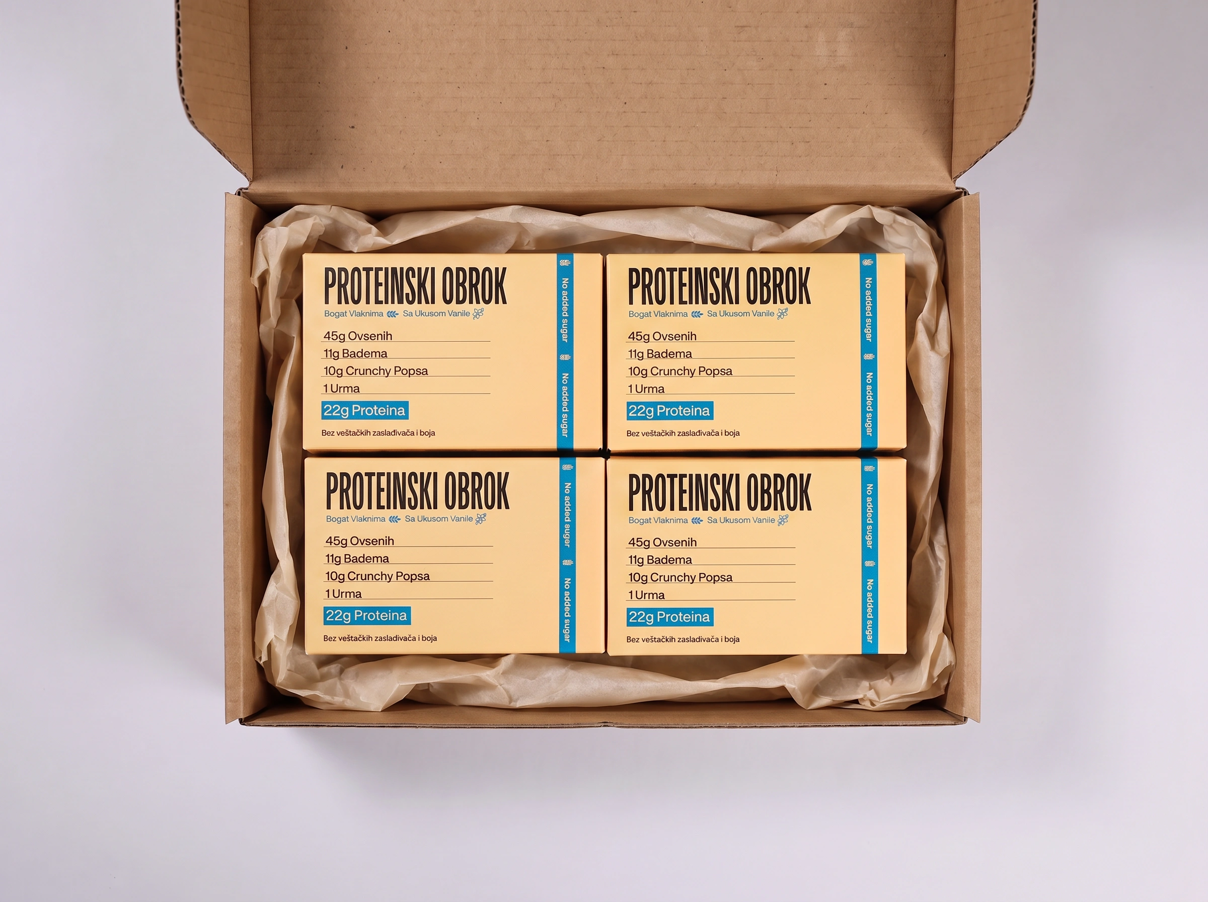 Four vanilla PROTY snack bars with vanilla flavor, arranged on a white background, showcasing the product packaging.